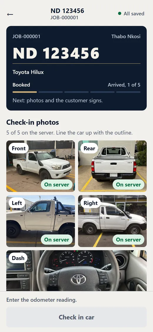 Check-in screen with five photos of a white bakkie: front, rear, left, right and dash